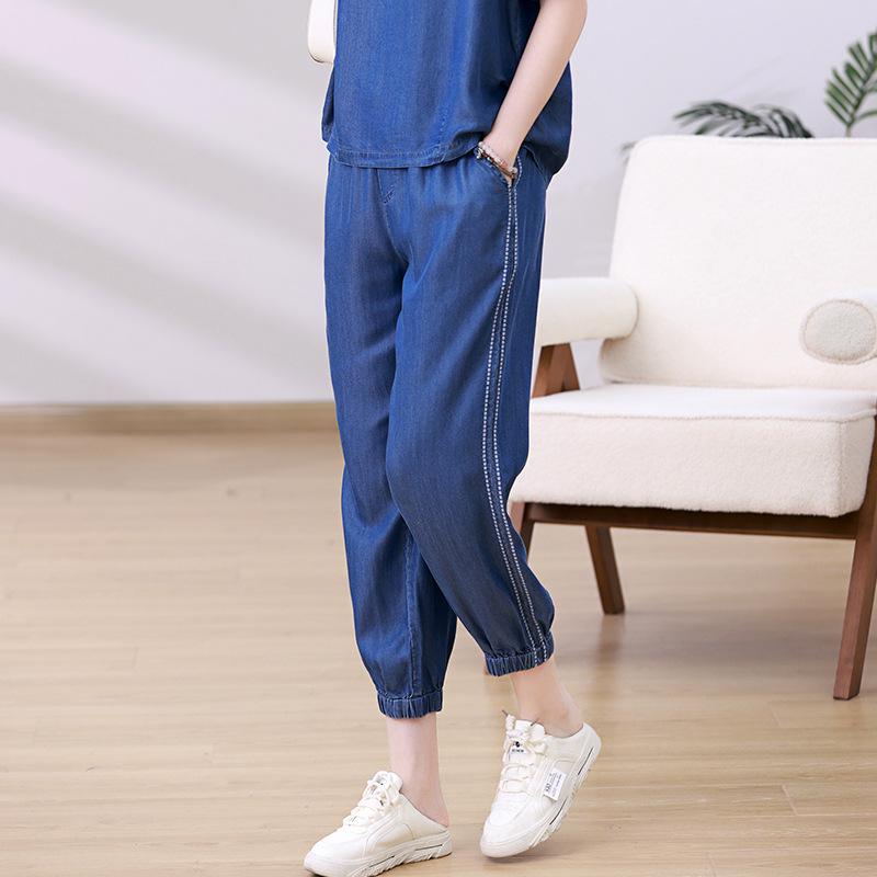 

Женские джинсы-гаремы из эластичного тенселя с высокой посадкой, пэчворк - Коллекция Лето 2025 L джинсовый синий