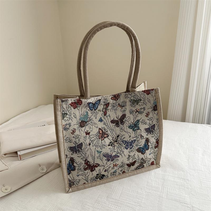 

Весна 2024 корейська версія літературних та артистичних жіночих сумок великої місткості, нові модні робочі сумки-багети, сумки-тоут на плече, тренд бежевий