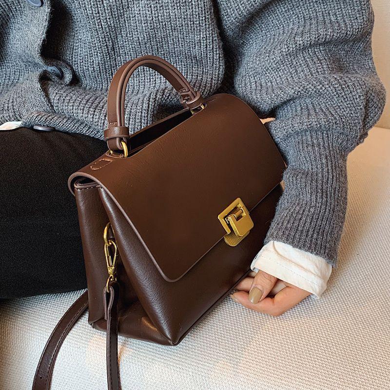 

Premium textured bag women s new French handbag hand carry out shoulder bag mature versatile messenger bag темно-коричневого кольору