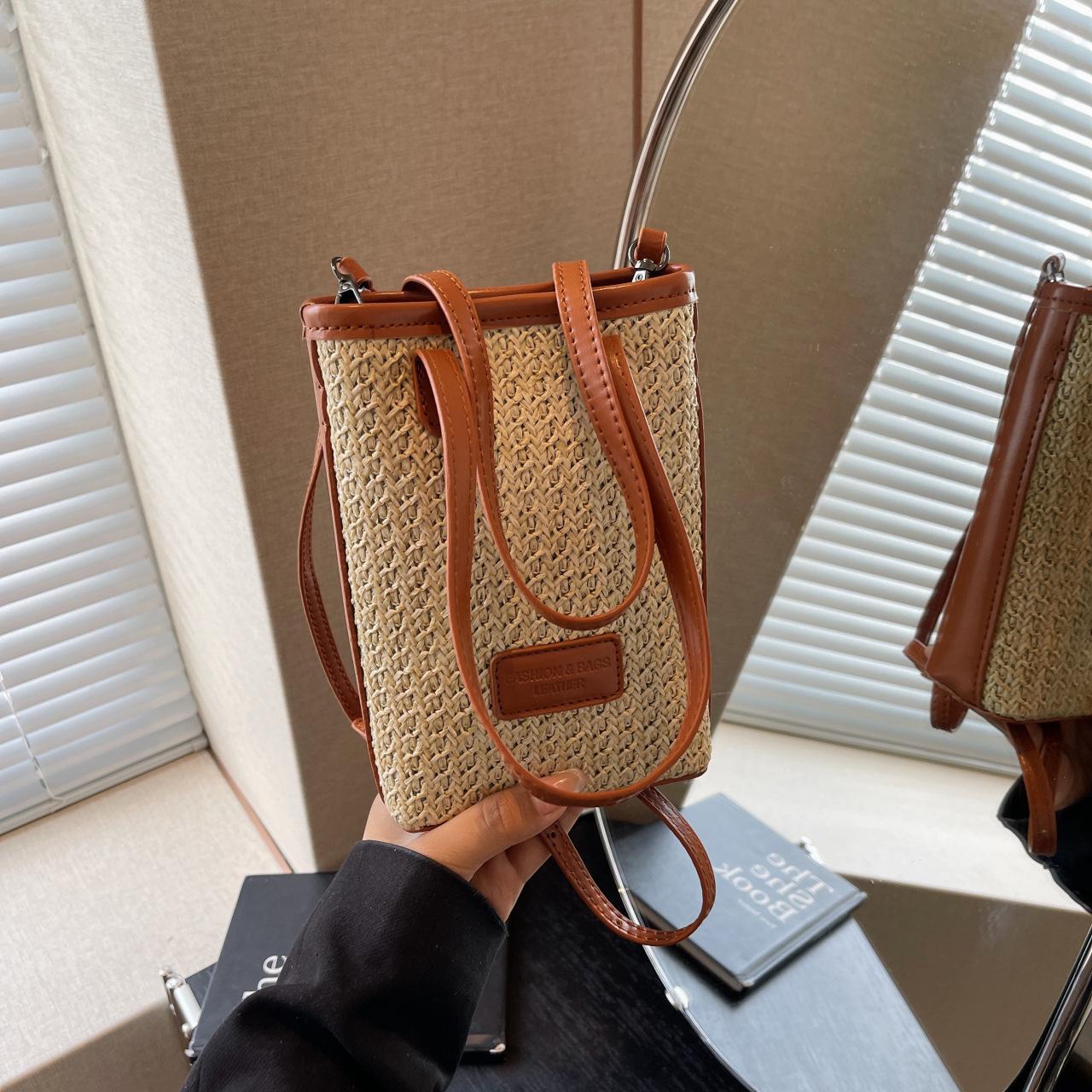 

Contrasting color striped woven small bag women s woven bag niche temperament versatile single shoulder crossbody mobile phone bag