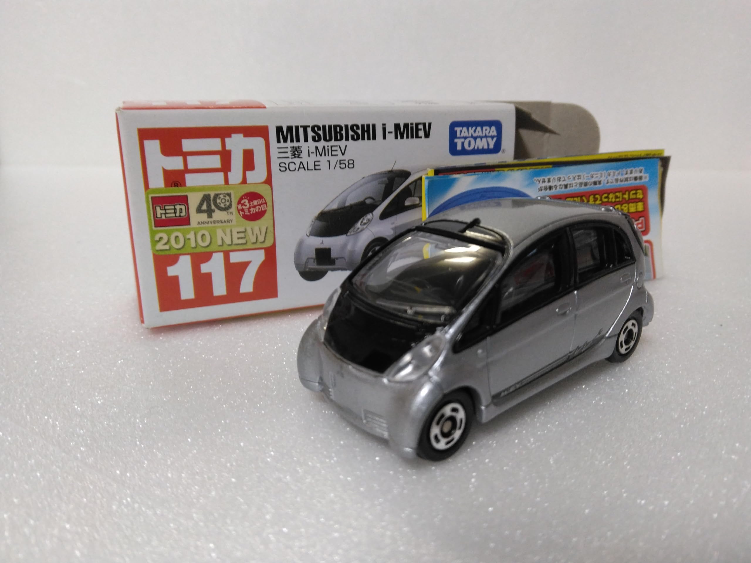 

Tomica Mitsubishi i-MiEV, масштаб 158, серебристый, № 117, модель 2010 года, с прозрачным корпусом