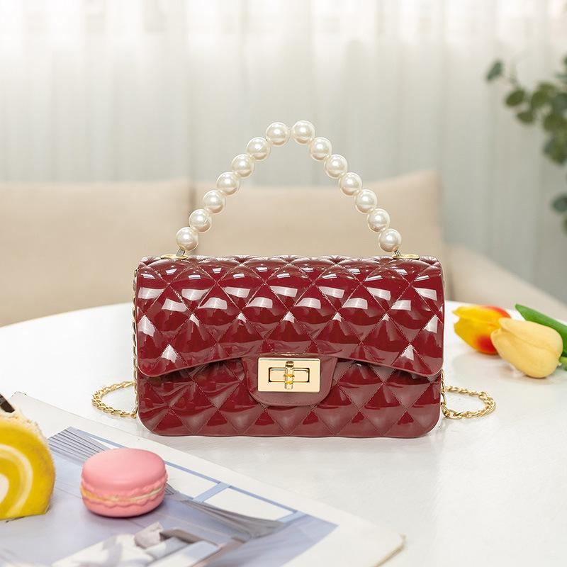 Fashion pearl shoulder jelly bag, women's versatile diamond lipstick change bag, one piece.
