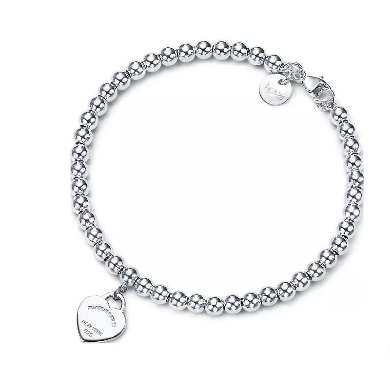 Herzförmiges buddhistisches Perlenarmband mit einem doppelherzförmigen Anhänger aus Emaille und Epoxidharz – ein modisches Armband für Damen