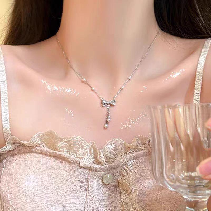 2024 Luxury Pearl Bow Tassel Necklace for Women - Chic Clavicle Chain Accessory