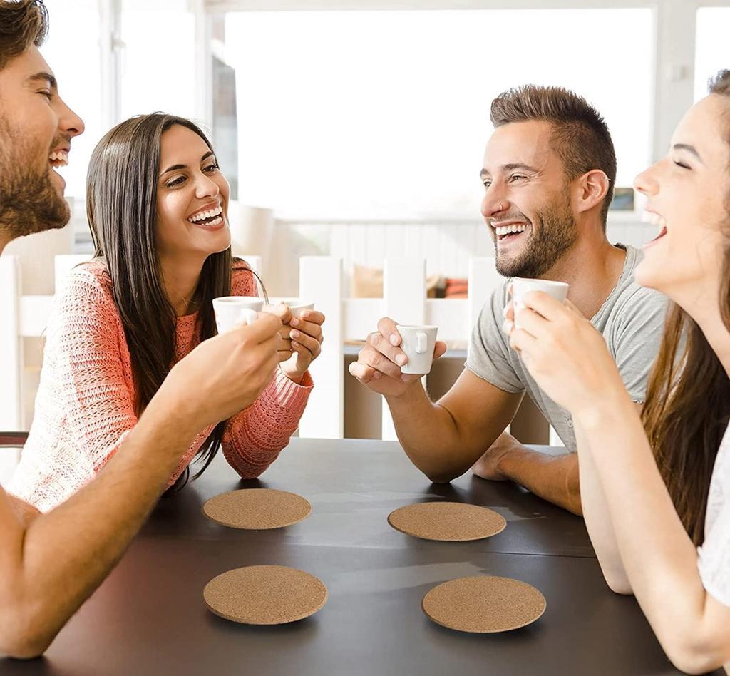 Stylish cork coasters, 5mm thick, 10cm diameter, round, pack of 100. Heat-resistant, non-slip, and perfect for coffee tables. A warm gift for home