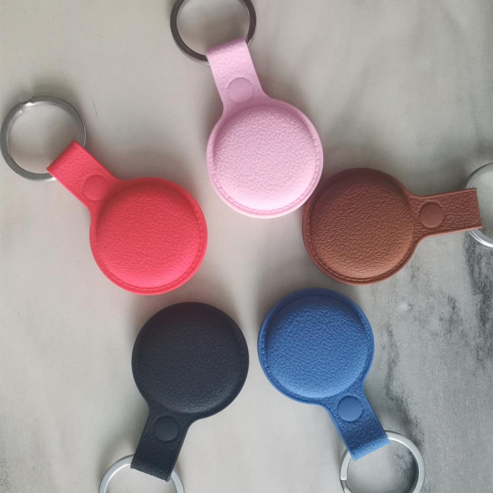 Apple AirTag silicone case with genuine leather texture for high-end fashion and premium protection.