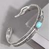 Bracciale Aperto da Uomo con Piuma Retro