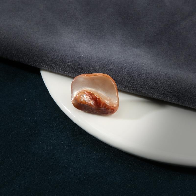 

Высококачественные ракушечные пуговицы Мужская и женская одежда Пальто Пальто Высококачественные нестандартные пуговицы Детский свитер Кардиган Маленькие пуговицы 7 #Orange * Length About 2cm Width About 1.6cm