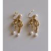 Sweet and cool personality natural freshwater pearl bow mosquito coil disc earclip temperament cold wind earrings women's stud earrings