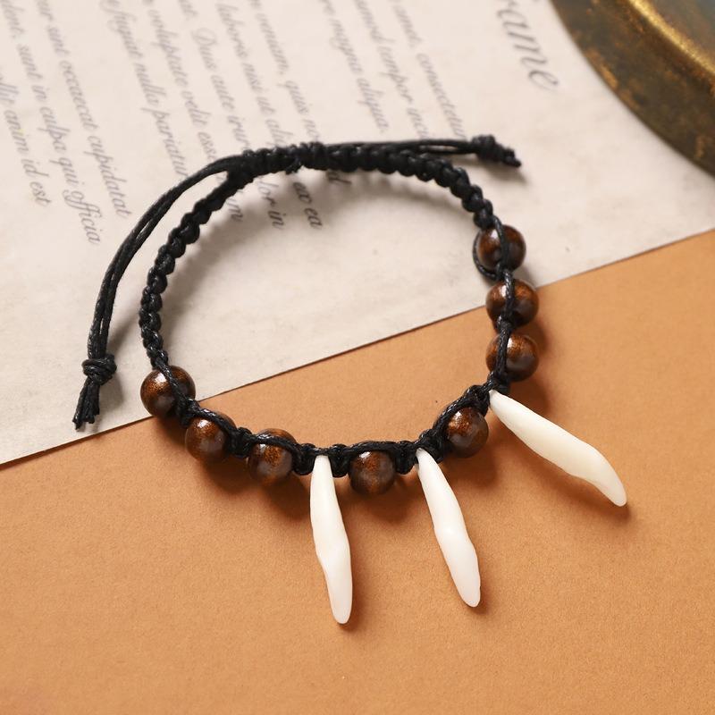 Retro Tibetan braided dog tooth bracelet handmade exotic personalized hand rope niche stacked wear men's and women's accessories