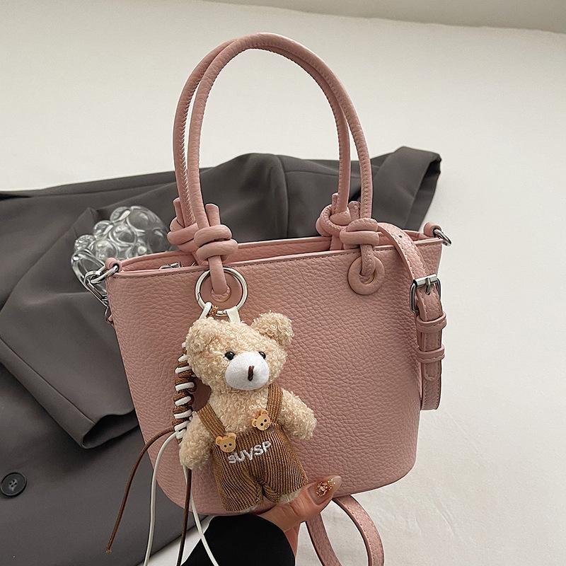 Wholesale hot sale high quality casual lychee pattern solid color portable bucket bag versatile simple wind commuter messenger bag women