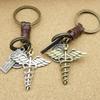 Herren Retro Caduceus Medizinisches Symbol Schlüsselanhänger mit Engelsflügel Anhänger
