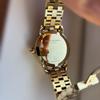 Used Tory Burch gold color watch
