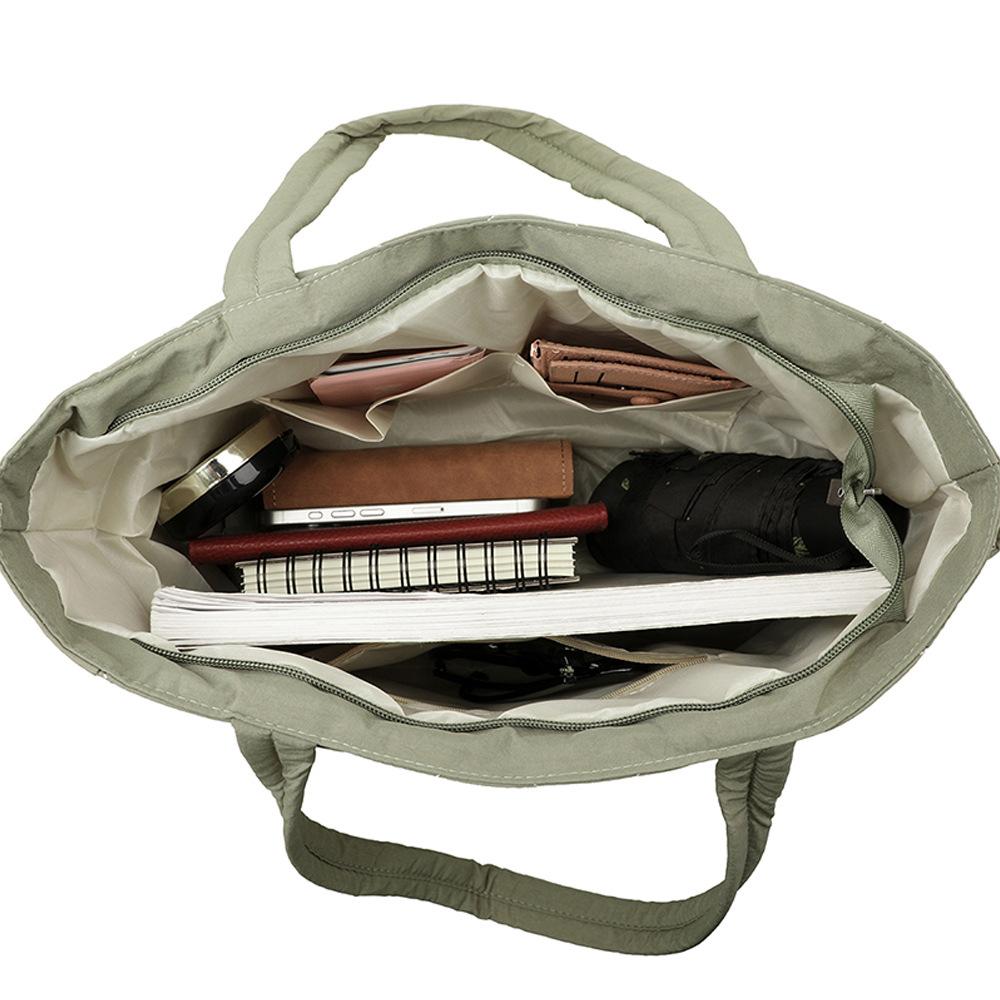 Tragetasche, Eine lässige und leichte Ein-Schulter-Handtasche mit großem Fassungsvermögen in Diamantform