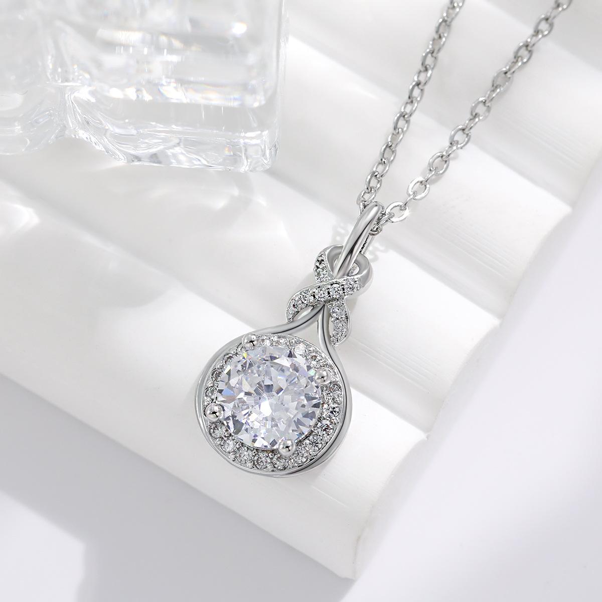 Luxury Diamond Accent Teardrop Necklace Set with Minimalist Circular Infinity Symbol Design