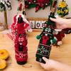 Cozy Knitted Christmas Wine Bottle Cover With Bright Bow And Cheerful Pom Poms For Parties