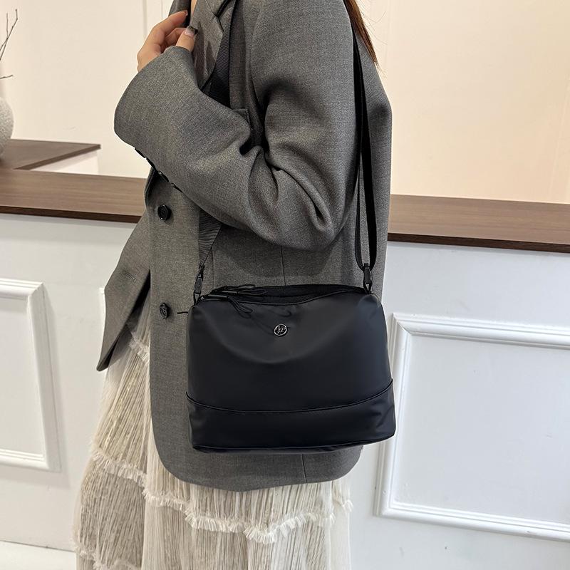 Casual simple and fashionable waterproof one-shoulder messenger bag female handwritten multi-layer nylon cloth urban cycling square bag versatile