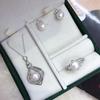 Silver Needle Pearl Jewelry Set: Pearl Necklace, Earrings, and Ring with Beaded Inlay and Fashionable Style.
