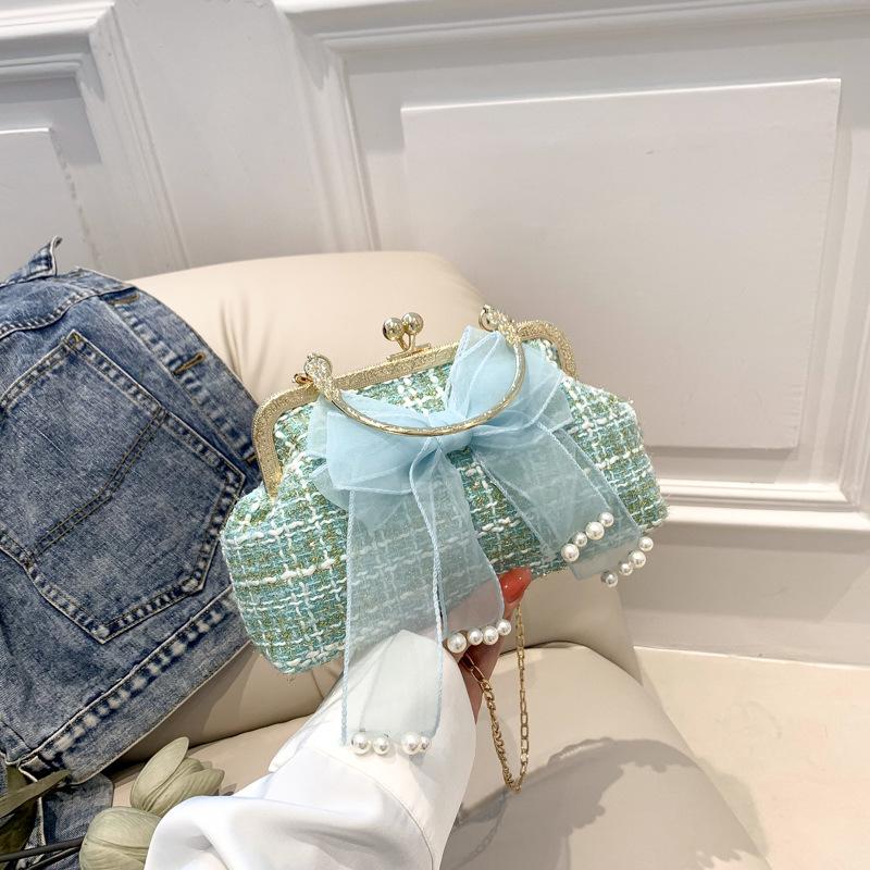 

Нишевая сумка женская 2025 новая плетеная сумка-ракушка сумка-багет с бантом сумка под мышкой сумка-мессенджер сумочка зелёный