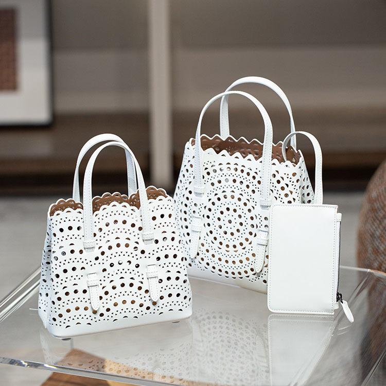 Velkoobchodní továrna prémiová niche vyřezávaná dutá taška na zeleninu Mina kožená dámská taška přes rameno crossbody tote taška