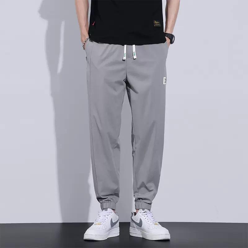 

Summer new casual pants men s thin ice silk tied feet loose and comfortable sweatpants 4XL светло-серый