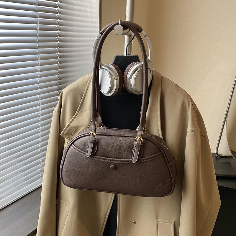 

Niche fashion texture hand-carried shell bag women s 2025 new Korean temperament foreign style commuter shoulder Boston bag