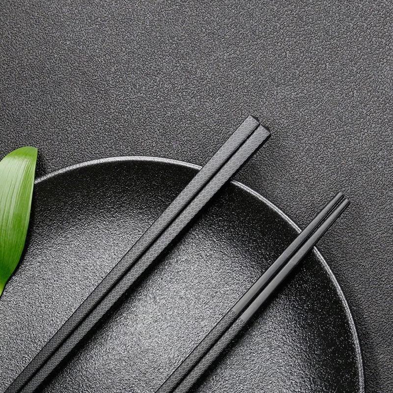 

Ru Han Black Alloy Chopsticks with Plum Blossom Design