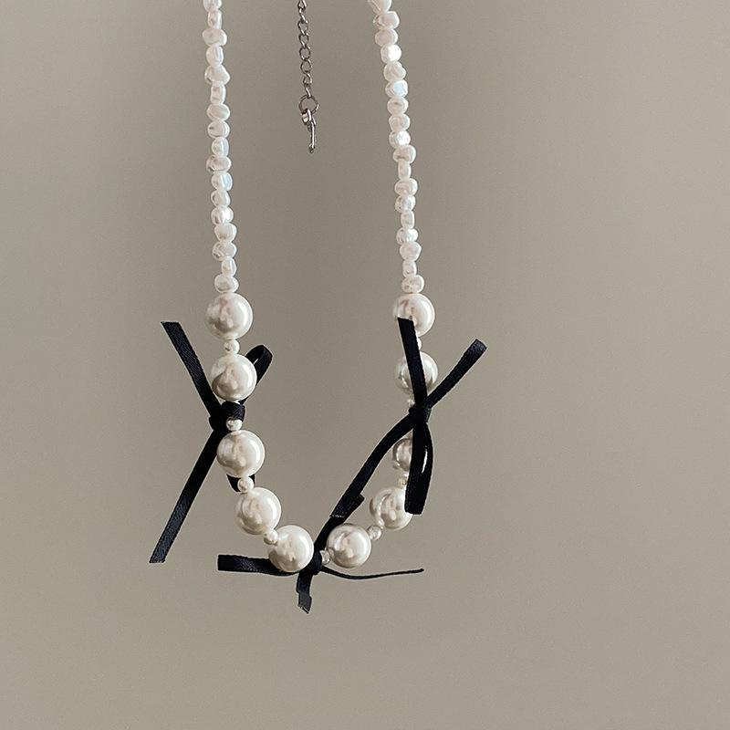 

Милое и классное стильное женское ожерелье с бантом из ленты и жемчугом в стиле ретро, легкое, роскошное, элегантное, премиум, универсальное, на шею, на ключицу