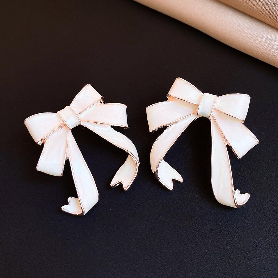Милые и нежные серьги-гвоздики в виде капающего масла с бантом, модные, изысканные и элегантные серьги.