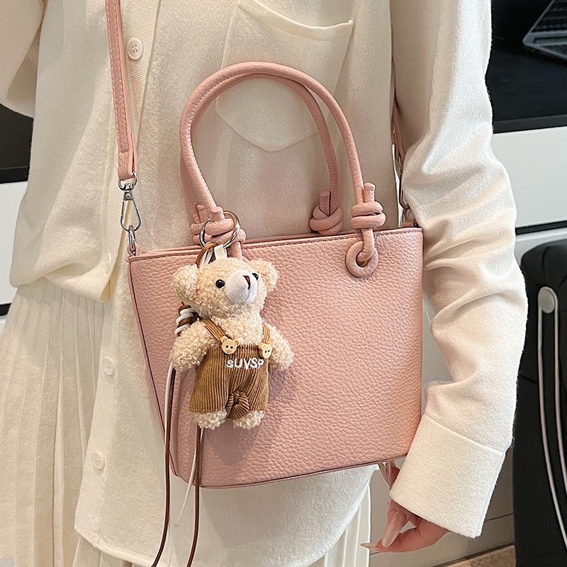 Wholesale hot sale high quality casual lychee pattern solid color portable bucket bag versatile simple wind commuter messenger bag women