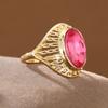 Vintage Hollow Copper Ring with Oval Red Artificial Gem for Women, Suitable for Banquets and Formal Occasions.