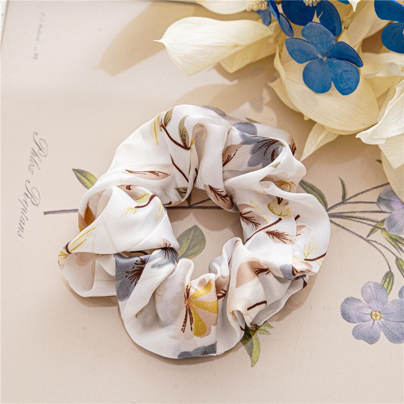 French-style smooth satin scrunchie with floral pattern, versatile elastic hair tie for women, popular on Instagram