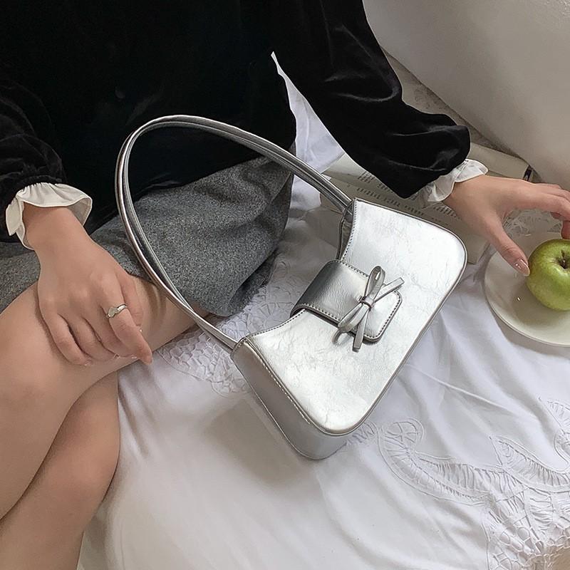 

2025 New Korean Style Girl Bow Tie French Stick Armpit Bag Niche Design Commuting Simple All-match One-shoulder Portable