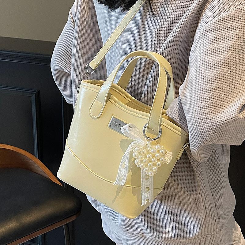 Koreańska wersja popularnej prostej wysokiej jakości koreańskiej przenośnej torby-wiadra modna wszechstronna styl commuter miejski casualowa torba listonoszka damska