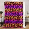 Black leopard spots on a gradient background of orange, pink, and purple. for all seasons blanket lunch break throw gift
