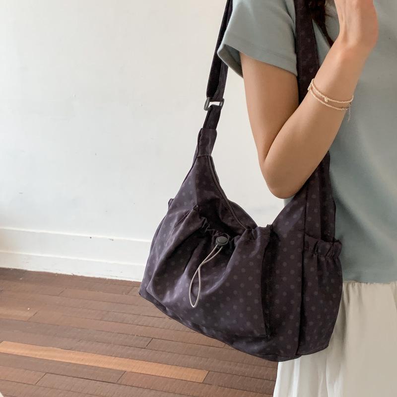 Korean Style Artistic Polka Dot Drawstring Pleated One-Shoulder Crossbody Bag for Women - Large Capacity, Portable, and Perfect for Commutes.