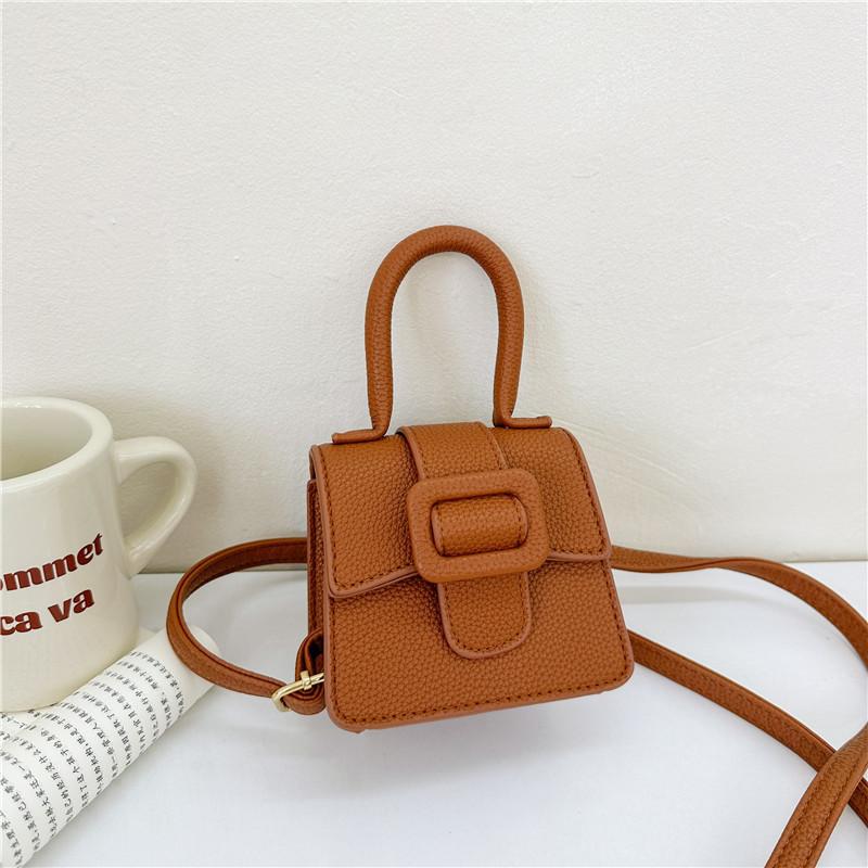 Chic Children s Mini Saddle Handbag Featuring Litchi Texture And Modern Style коричневый
