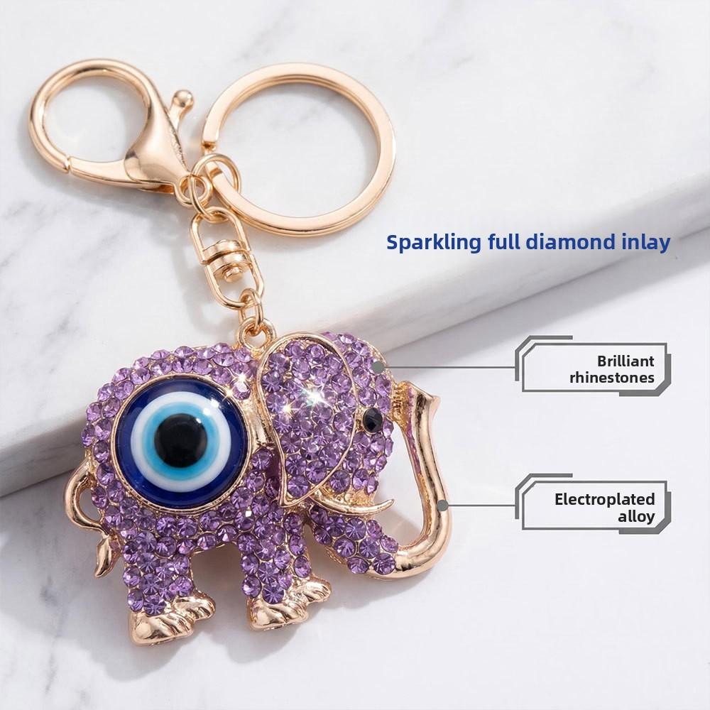 Neuer Schmuck mit blauen Augen - Diamantbesetzter metallisch farbener Elefanten-Schlüsselanhänger, Dämonenaugen-Anhänger