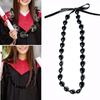 Collana di noci di kukui - Laurea Classe 2023 - Ghirlanda di noci con perline nere e fiocco - Regalo di laurea - Accessorio per feste
