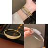 Elegant Striped Oval Bangle Bracelet With Gold Plating For Fashionable Women