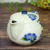 Waza no Kura: Stylish Kutani ware teapot with camellia design and tea strainer. Made in Japan. A premium ceramic brand. A great birthday gift.