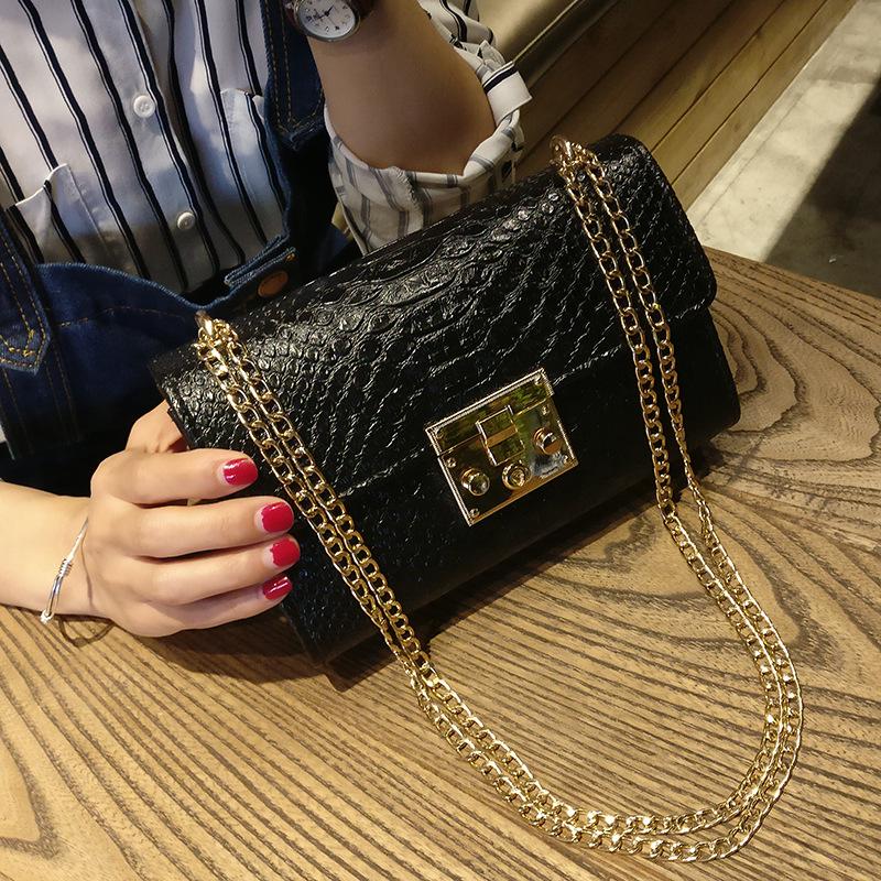 black crossbody purse with gold chain