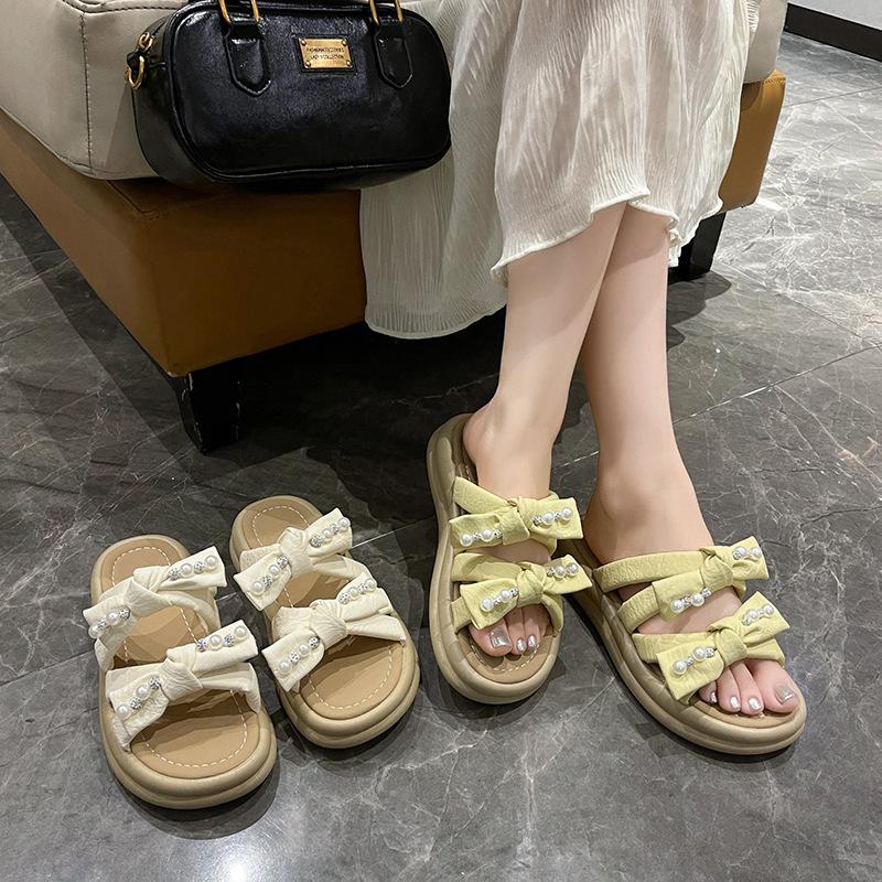 thick-soled pearl slippers for women to wear in the summer of 2025, the new fairy style fashion bow muffin open-toed sandals