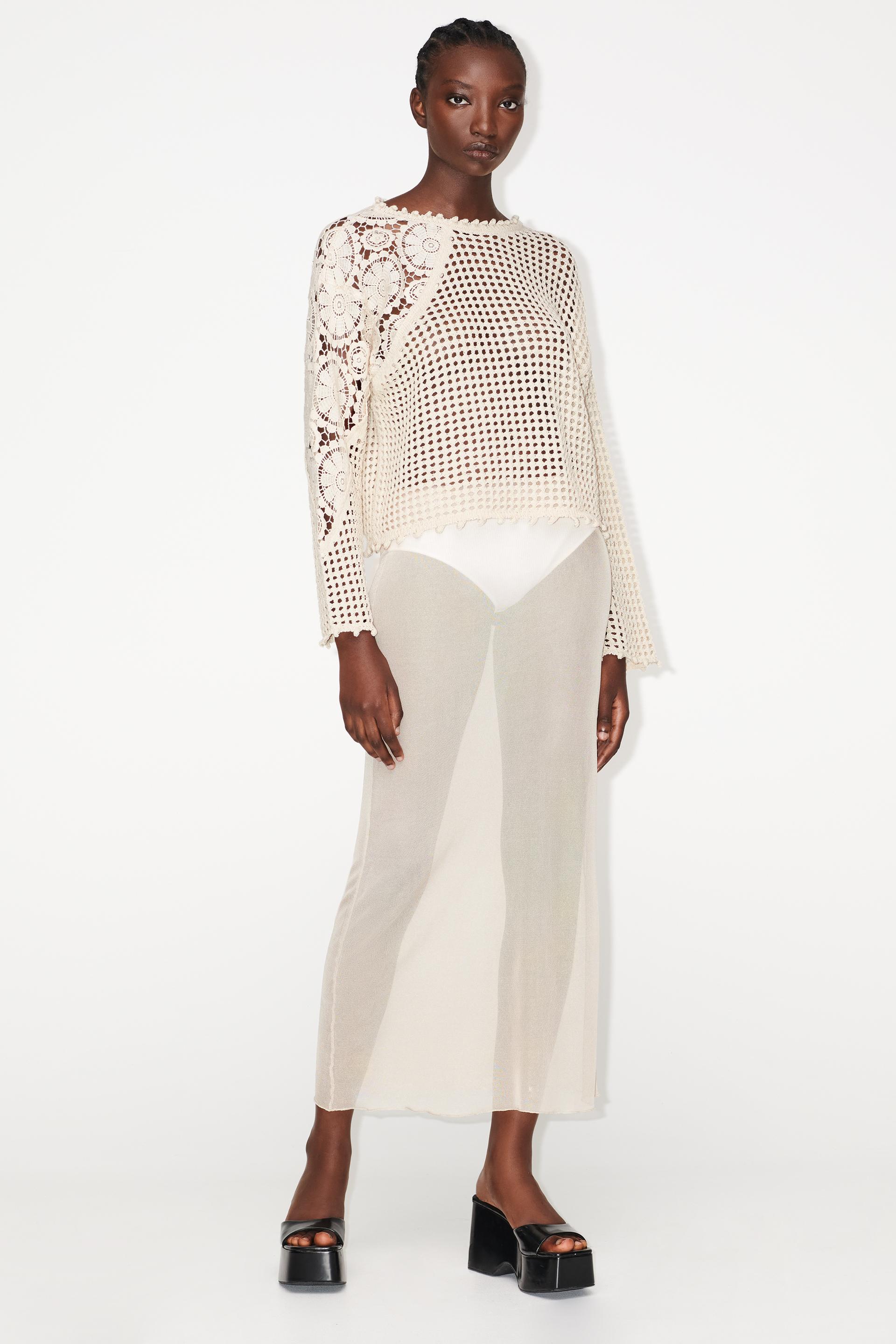 

KNIT SWEATER WITH CONTRAST SLEEVES