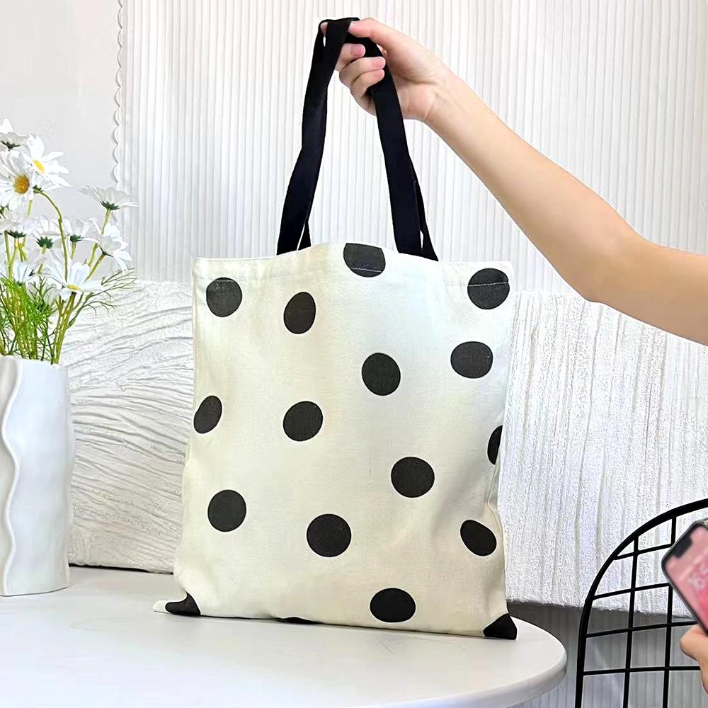 

225 new bag oversized canvas bag female student black and white polka dot small square handbag female student hand carry 35*38*5cm