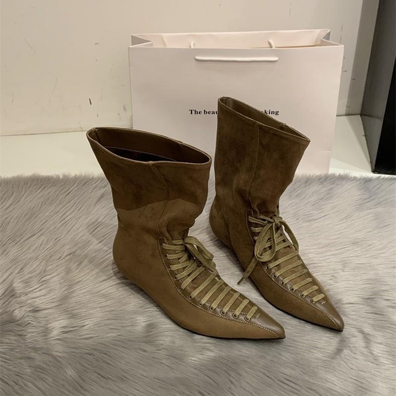 Niche pointed strap loose mouth witch boots spring new big tube circumference small high heel short boots design sense women's boots