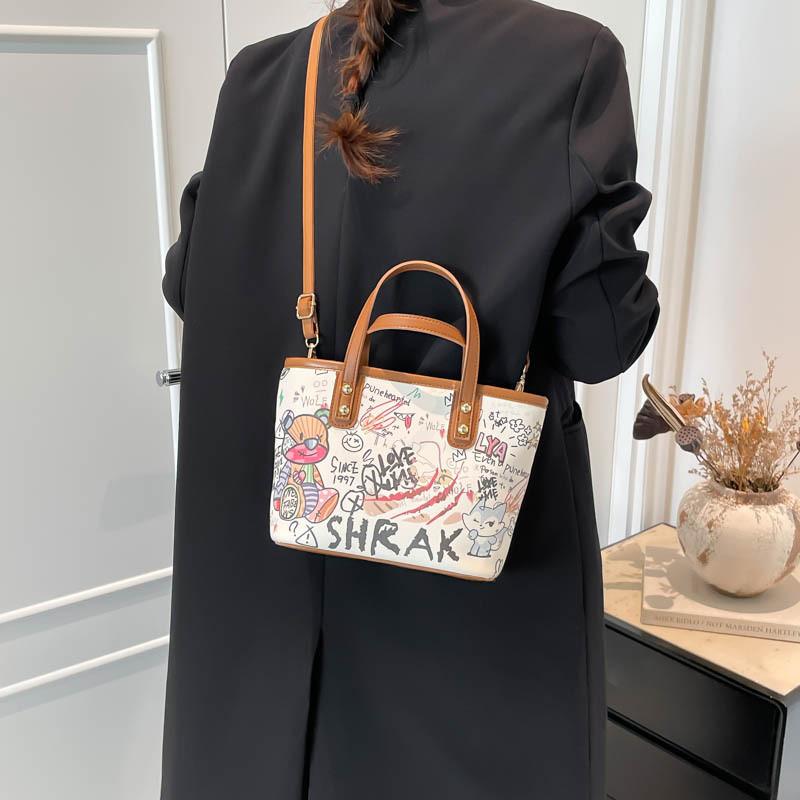 Große Eimer-Tasche aus PU für Damen mit Cartoon-Graffiti-Design, lässiger Streetstyle