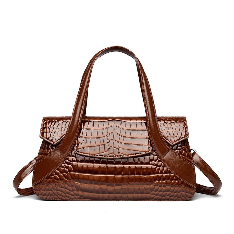 Diese Handtasche ist eine Damenhandtasche mit großem Fassungsvermögen und Krokodilmuster.. Es kann in der Hand, über der Schulter oder als Umhängetasche getragen werden.