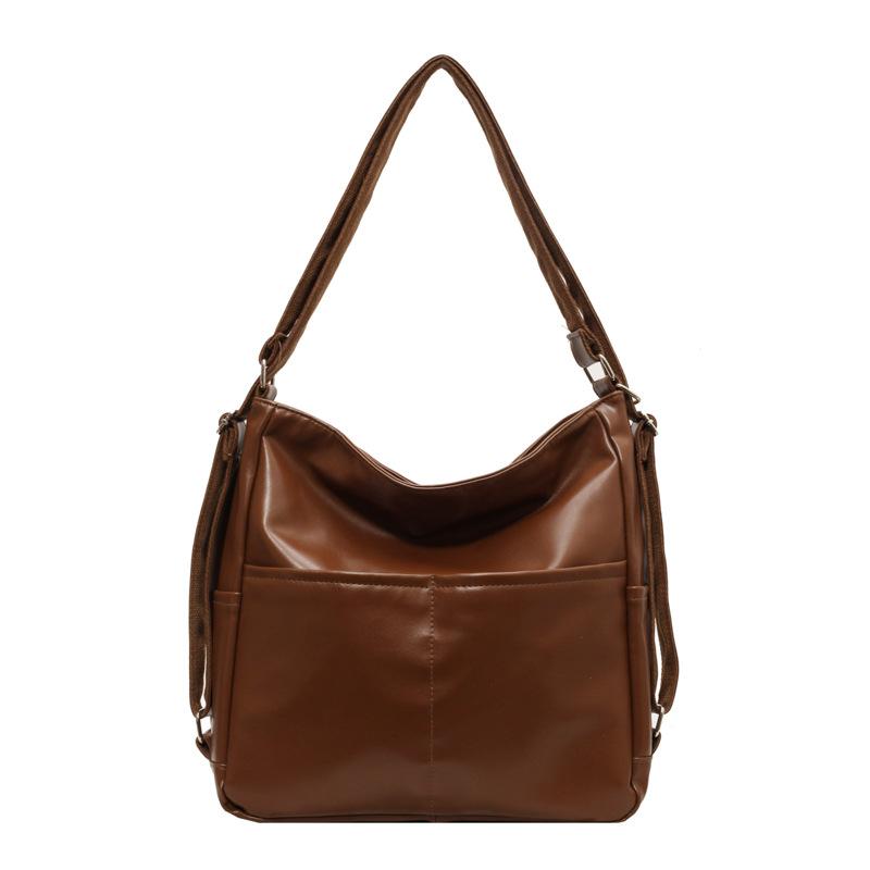 Lielas ietilpības pilsētas mugursoma sieviešu jauna pavasara un vasaras modes teksturēta plecu soma populāra retro iepirkumu soma