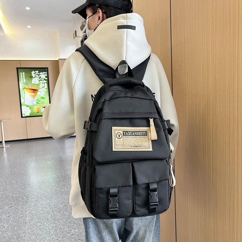 Fashionable casual large capacity multi-pocket labeling contrast color school bag for men and women students 23 autumn and winter new backpack